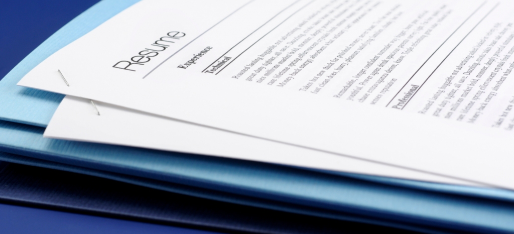 A stack of paper resumes, representing the older approach to reviewing and selecting applicants for interview.