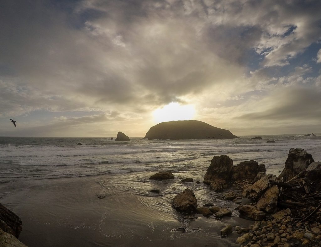 Photo of sunrise at Harris Beach State Park in Oregon, a stop on one of the best scenic routes for motorhomes.